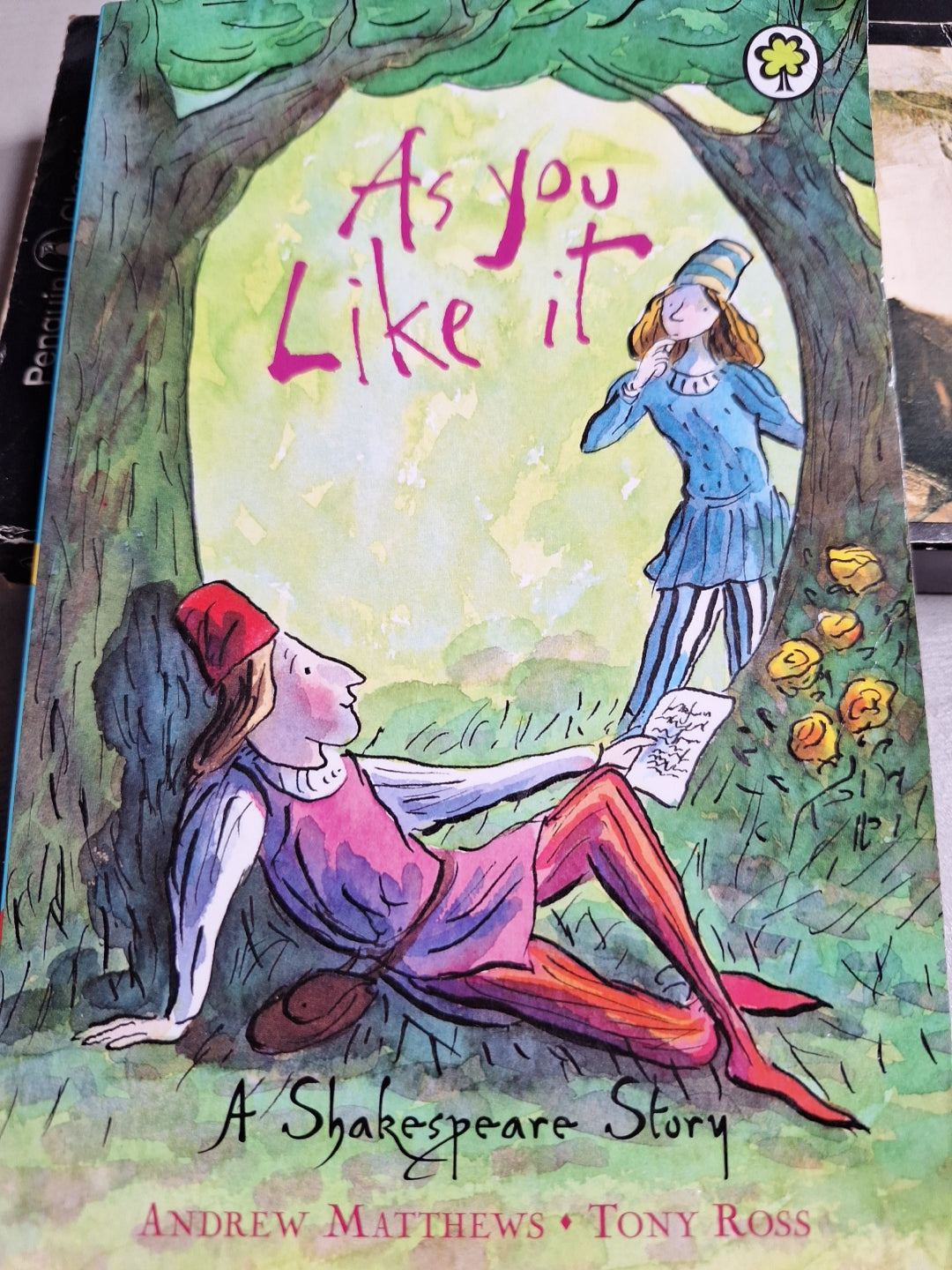 Cover of As you like it book with colourful illustration of two characters under a tree