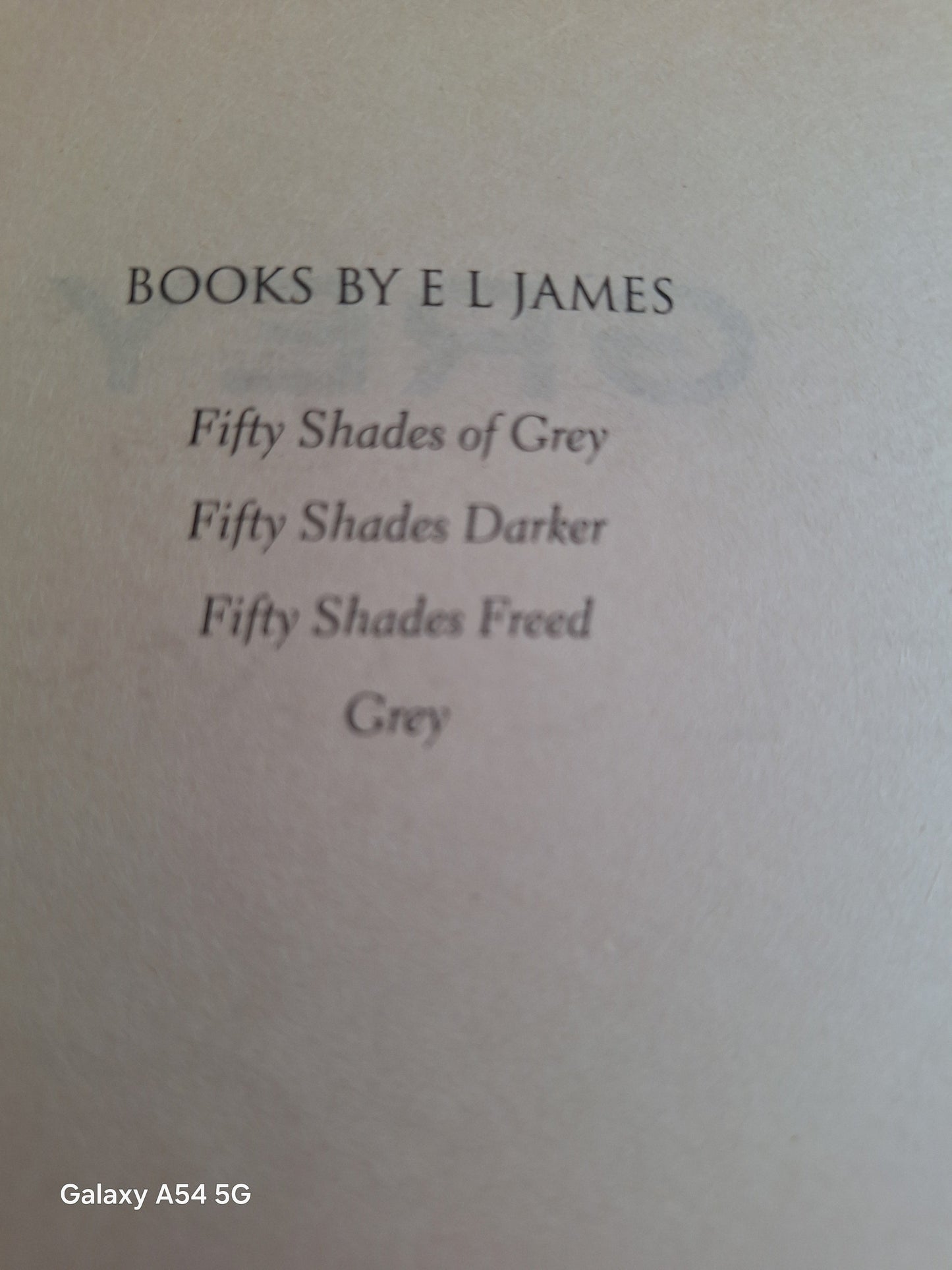 Fifty Shades of Grey told by Christian used book page listing other E L James titles