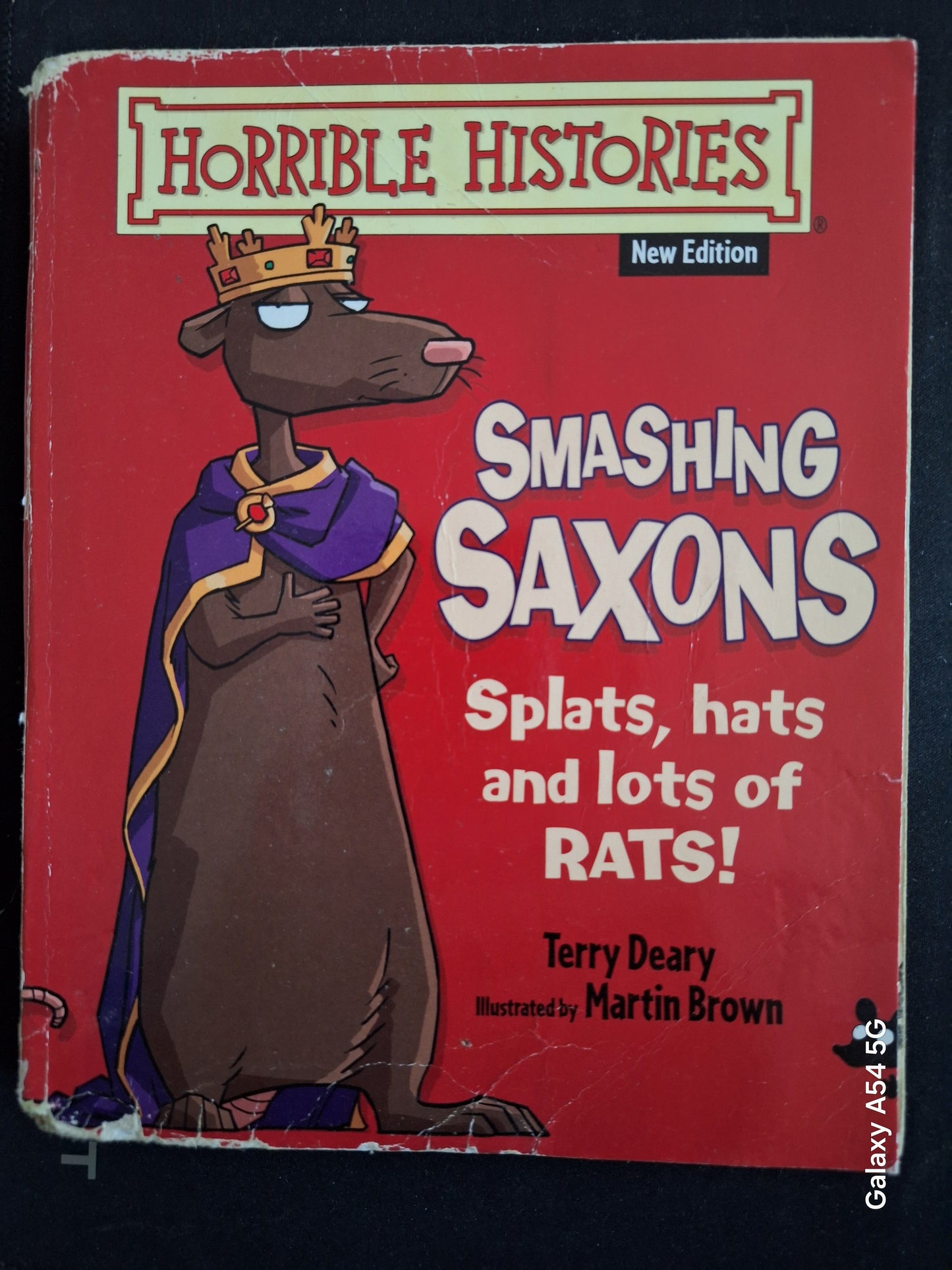 Horrible Histories Smashing Saxons book cover featuring a cartoon rat king with a crown and purple cape