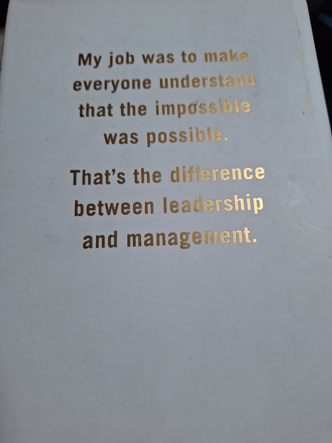 Book cover with inspirational quote about leadership and management using the keyword Leading