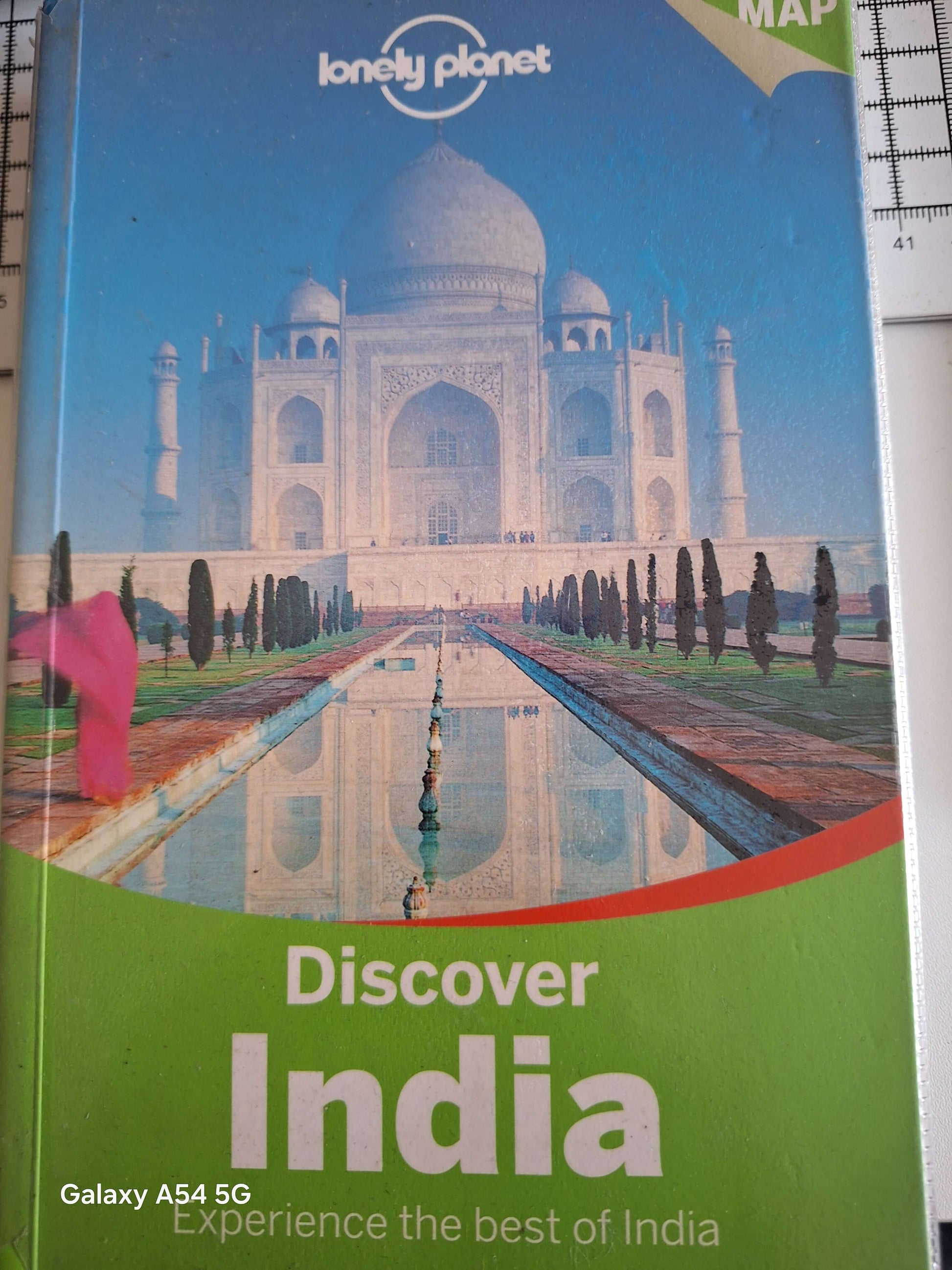 Lonely Planet Discover India Guidebook - Quality Bargain Book with a map cover featuring the Taj Mahal.