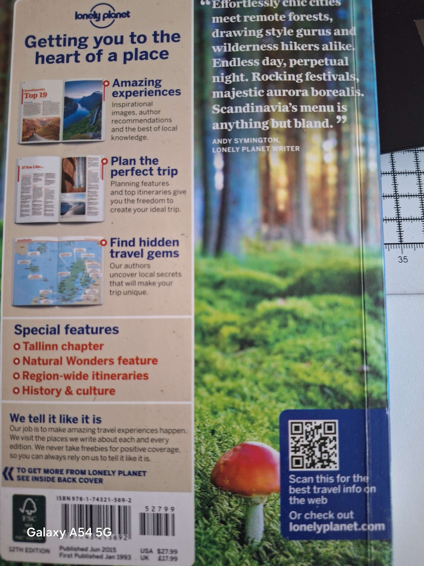 Scandinavia Lonely Planet guidebook cover showcasing travel tips and stunning Nordic landscapes.