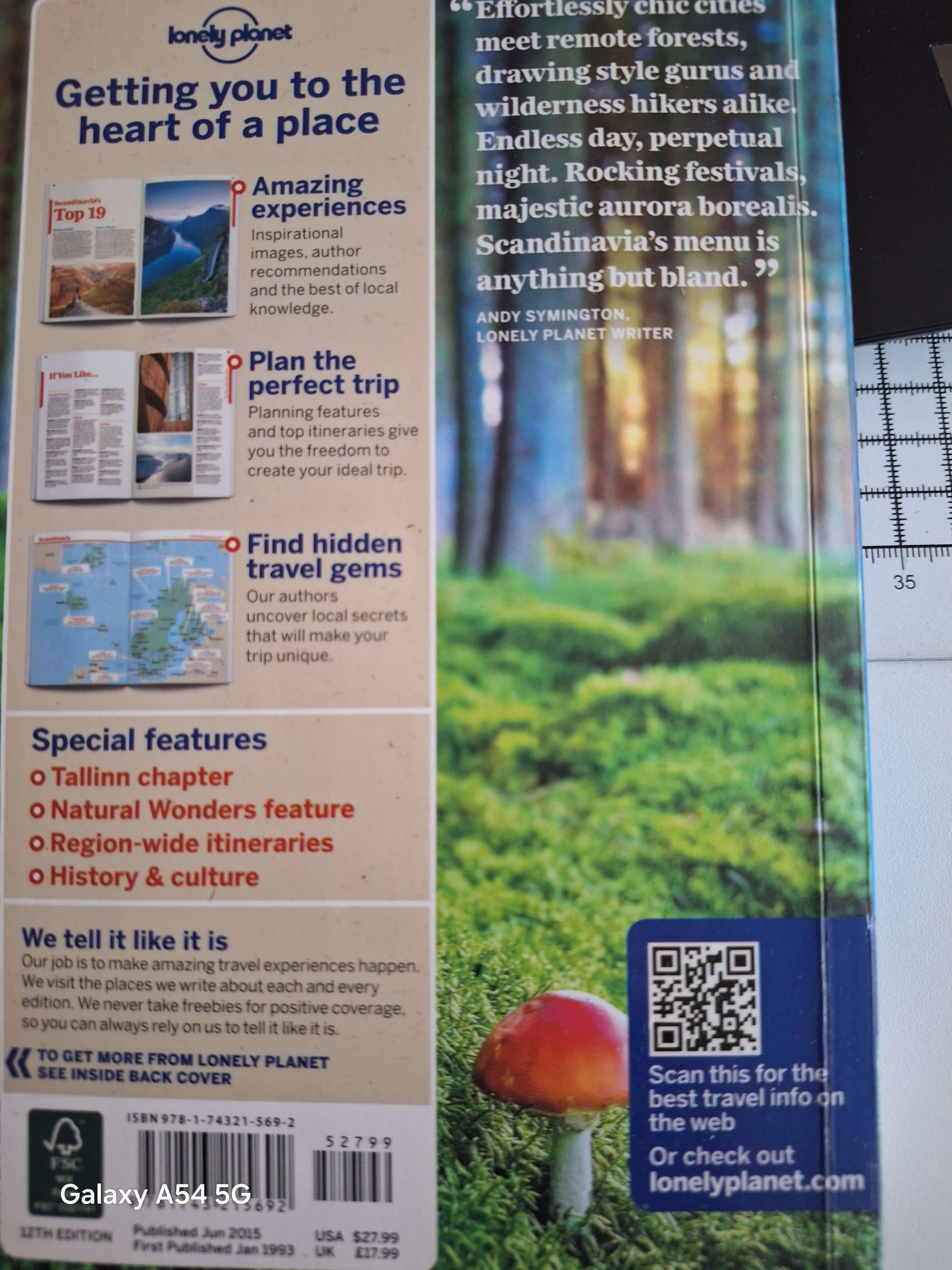 Scandinavia Lonely Planet guidebook cover showcasing travel tips and stunning Nordic landscapes.