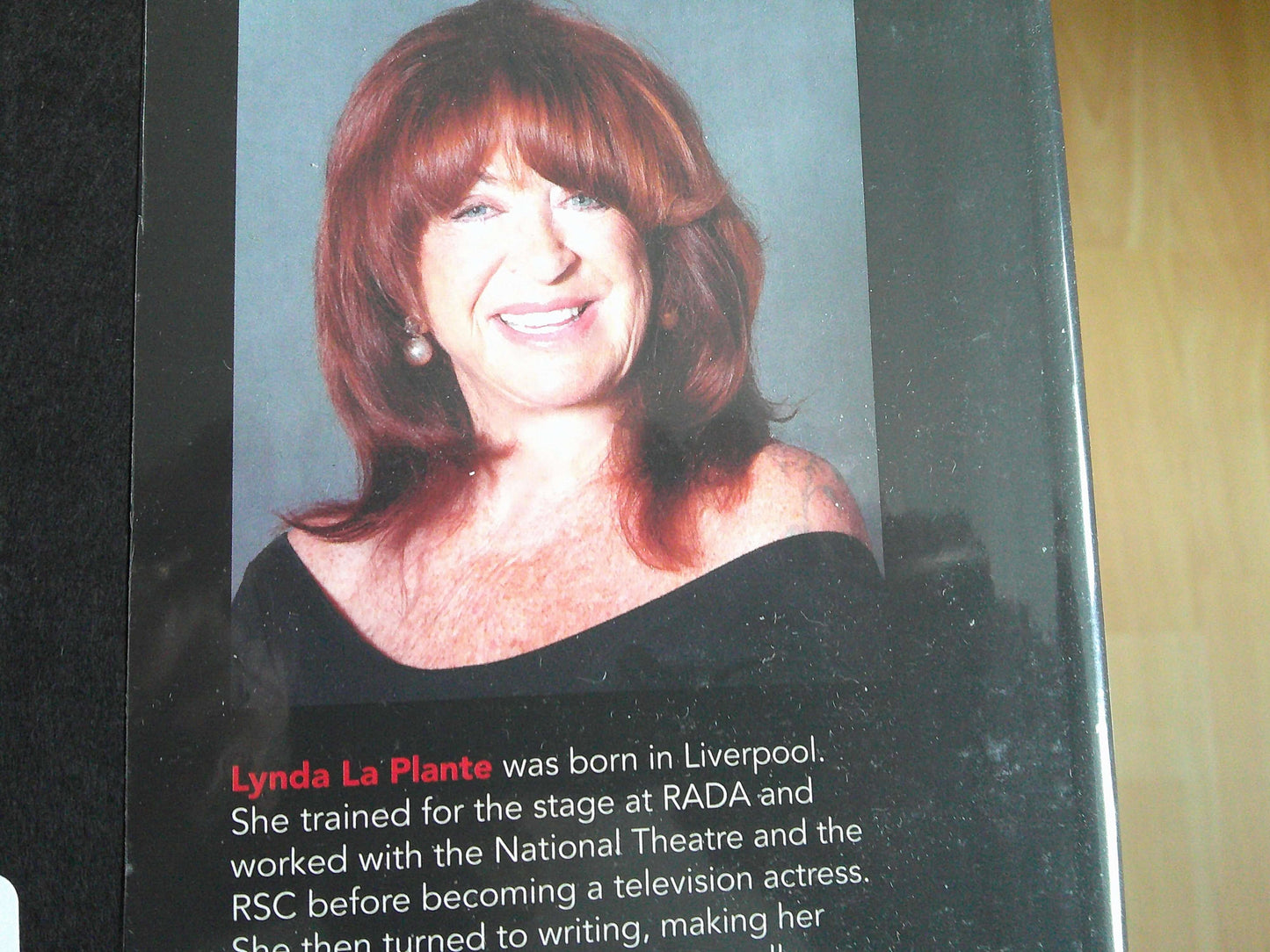 Widows Revenge Lynda La Plante book cover featuring the author with a vibrant smile and elegant attire