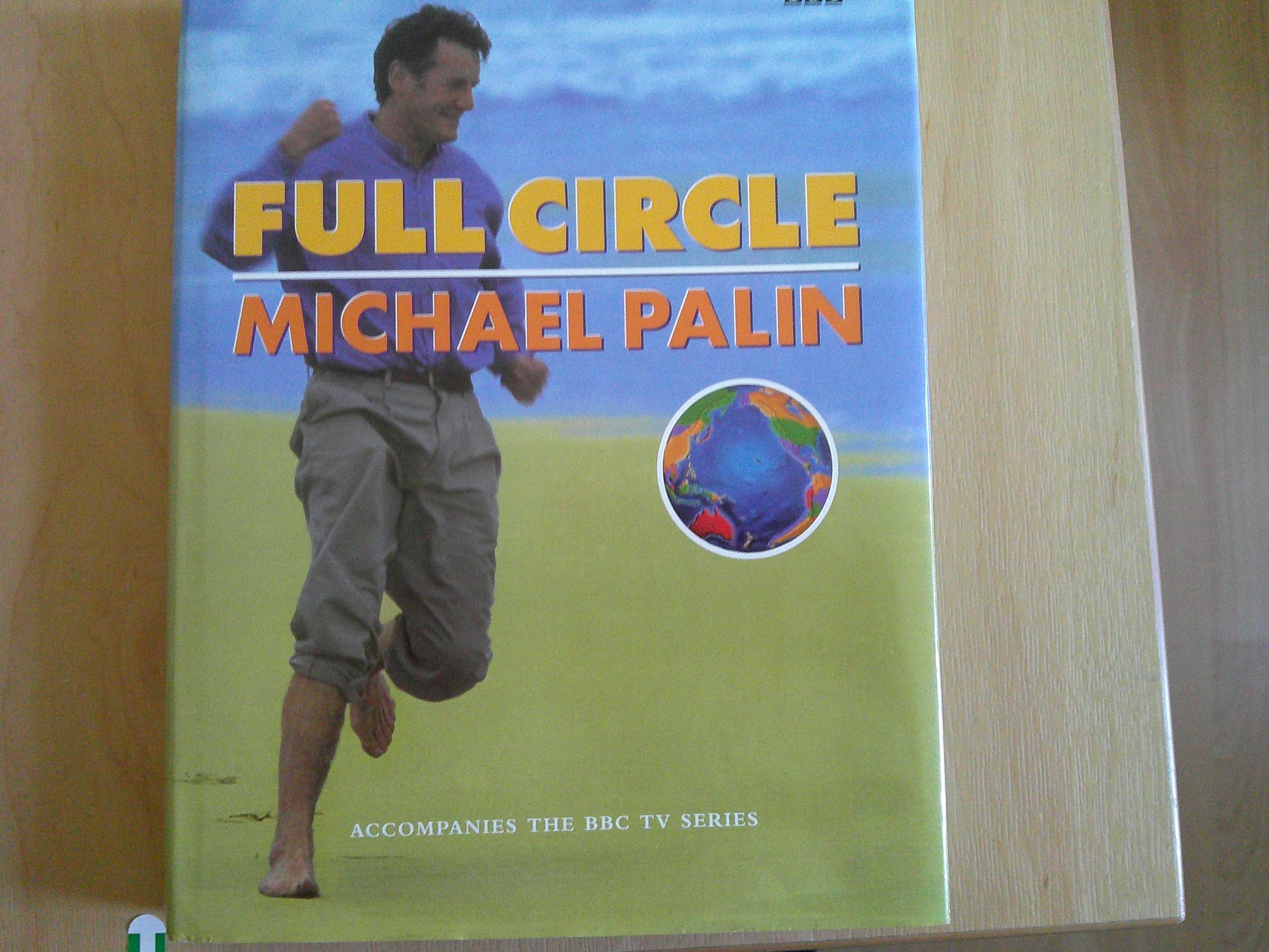Michael Palin travel documentaries book titled Full Circle, featuring the author on the cover in a scenic setting
