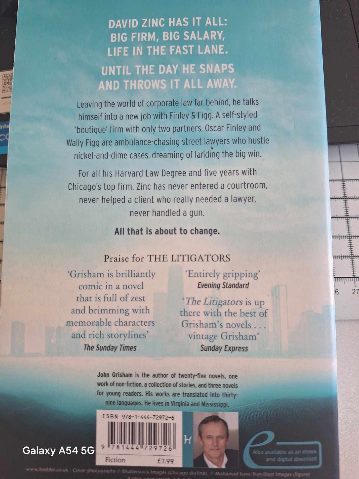 Used John Grisham The Litigators back cover featuring summary and praise for the novel